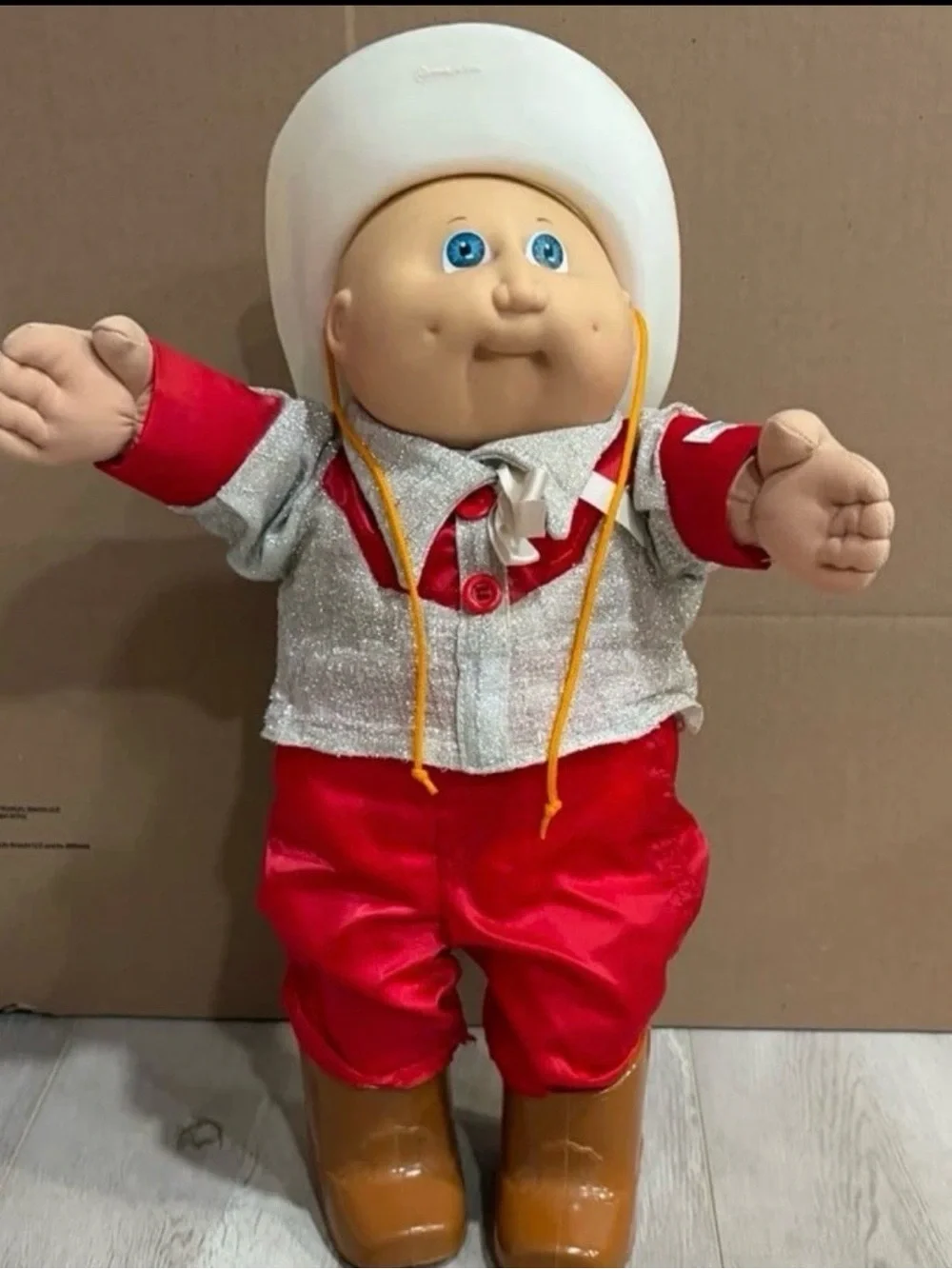 cabbage patch kids wearing a cowboy outfit with cowboy hat